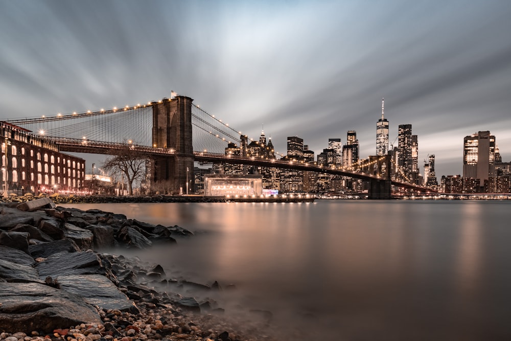 a long exposure photo of a city and a bridge