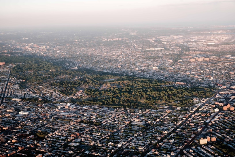 an aerial view of a city with lots of trees