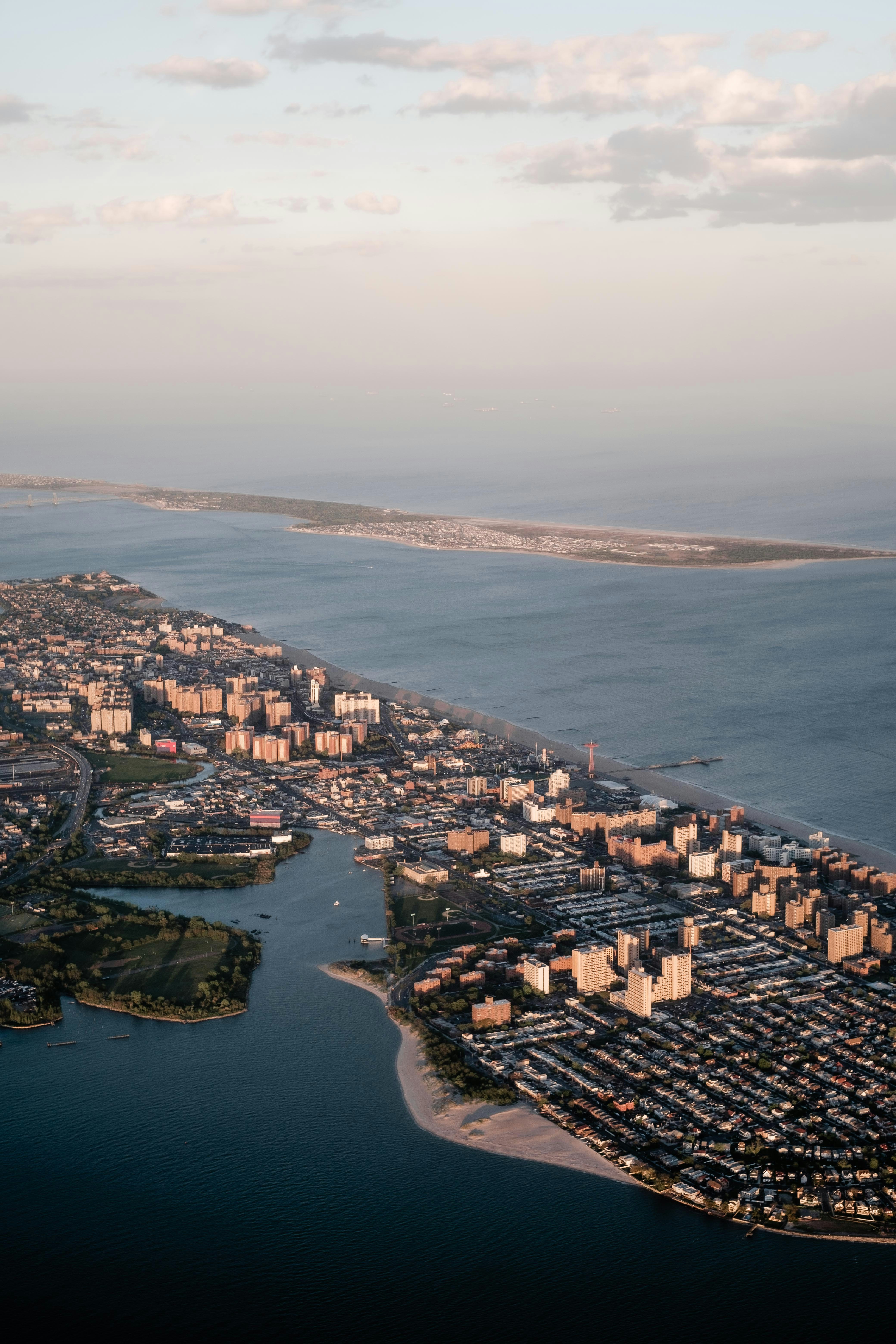 an aerial view of a city by the water