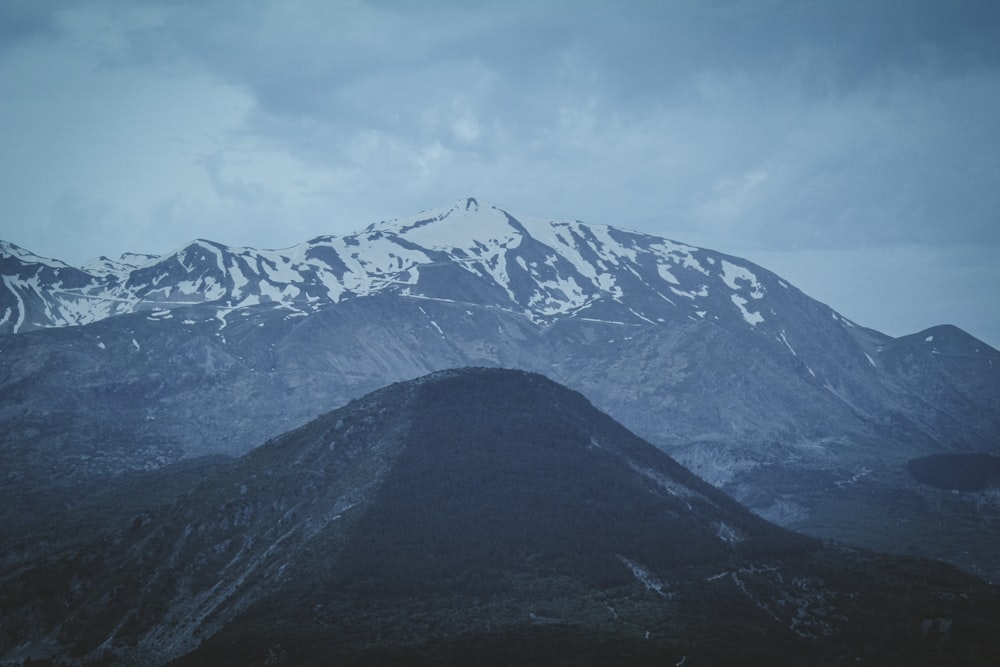 a mountain range with snow on top of it