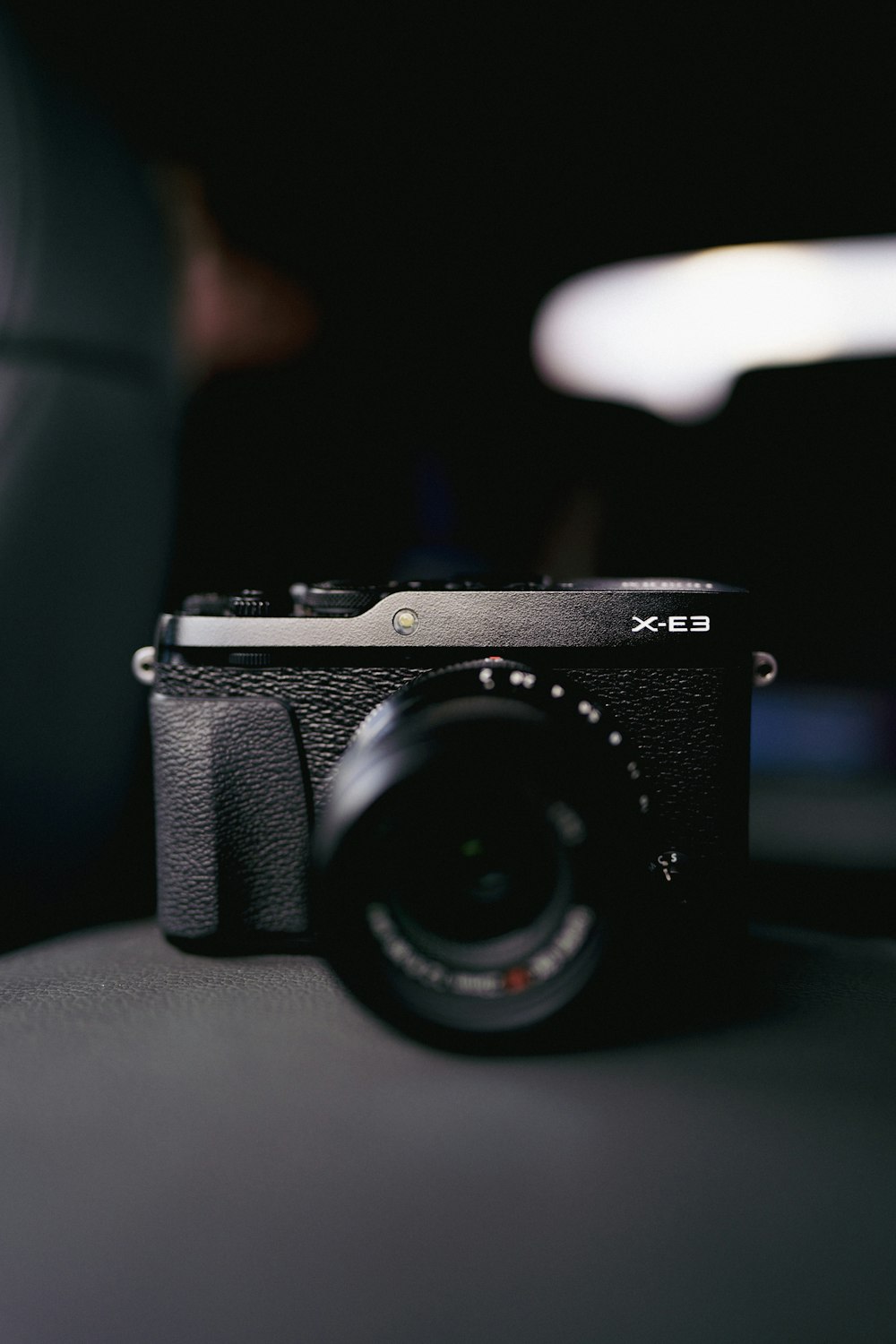 a black camera sitting on top of a table