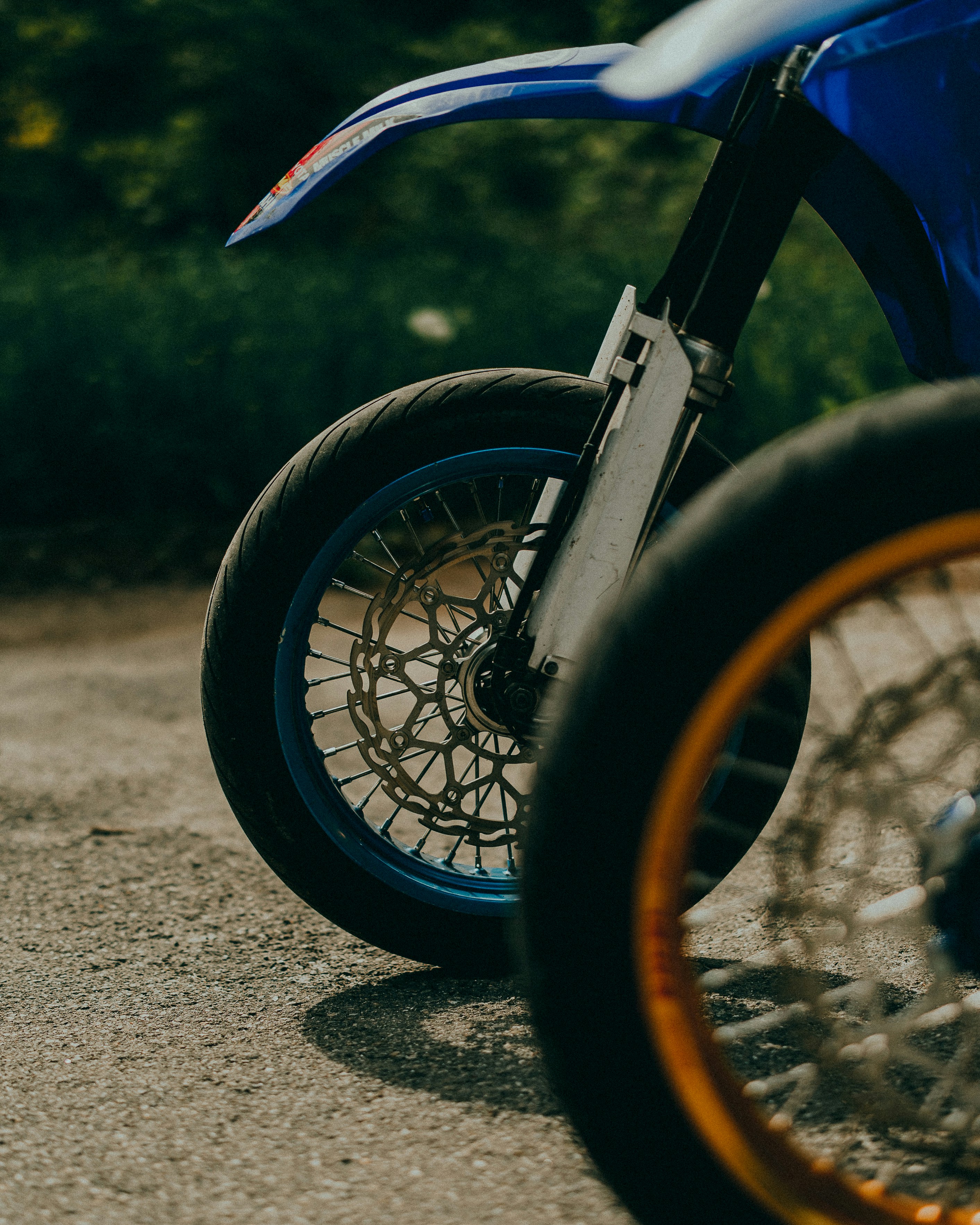 a close up of a motorcycle parked on a road