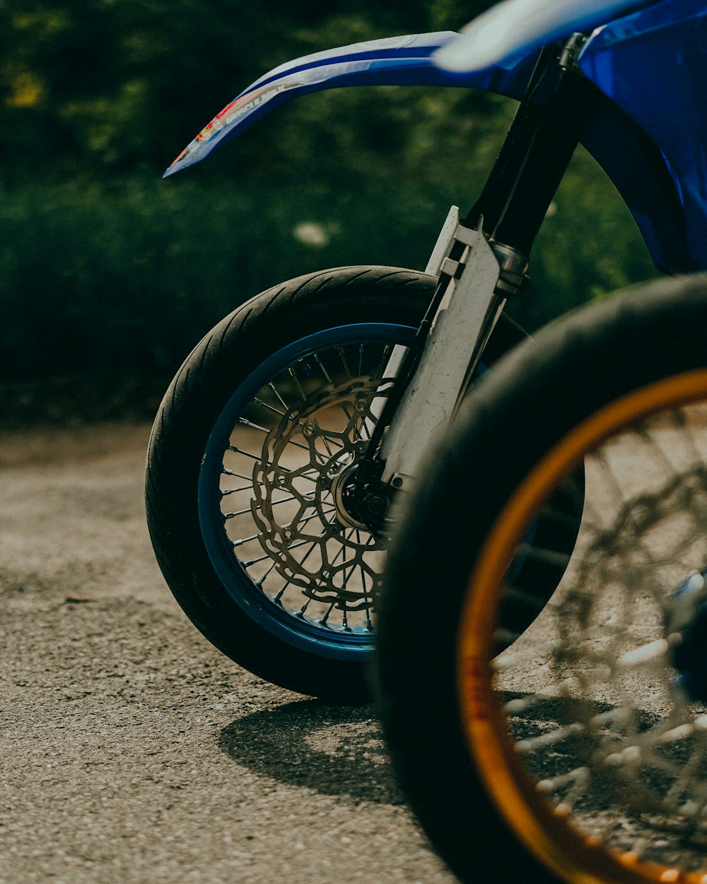 a close up of a motorcycle parked on a road