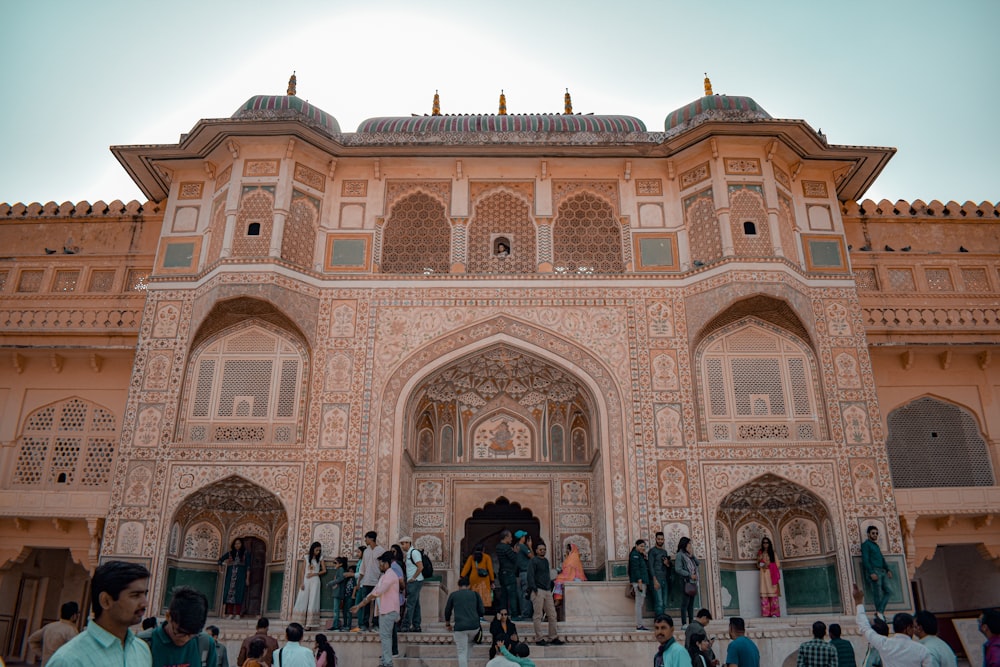 a group of people standing in front of a building