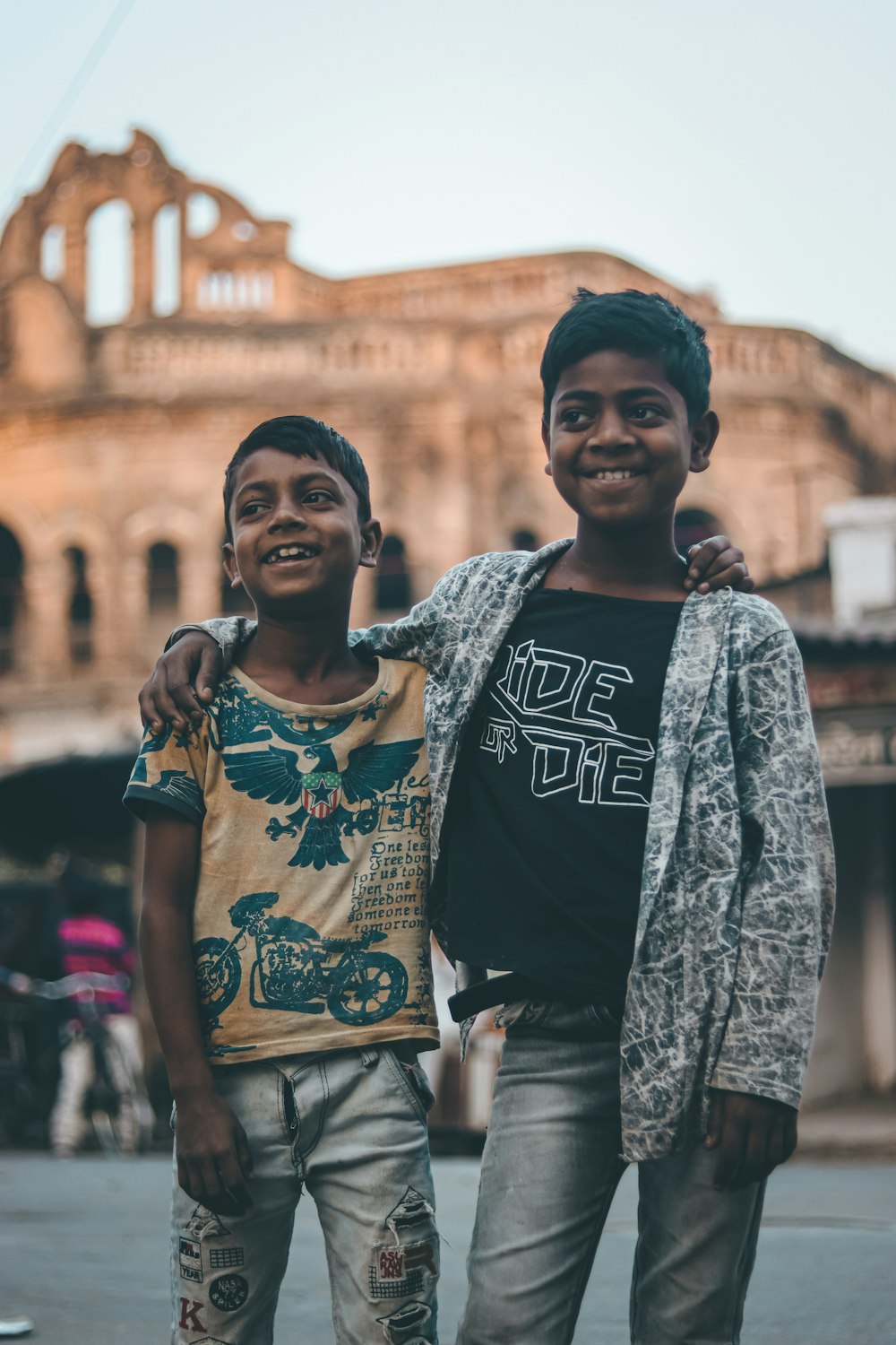 two young boys standing next to each other