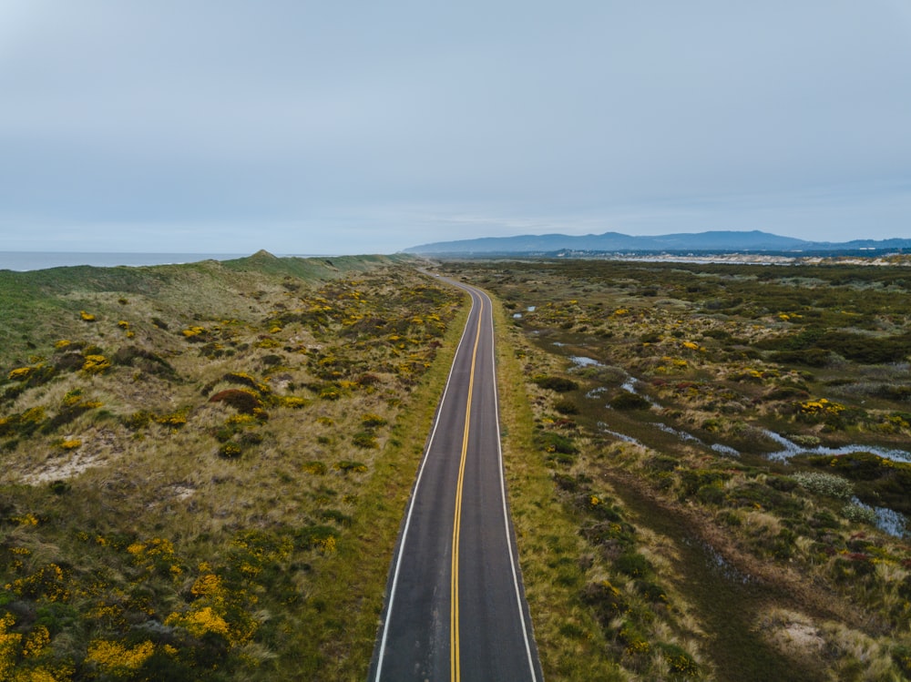 an aerial view of a road in the middle of nowhere