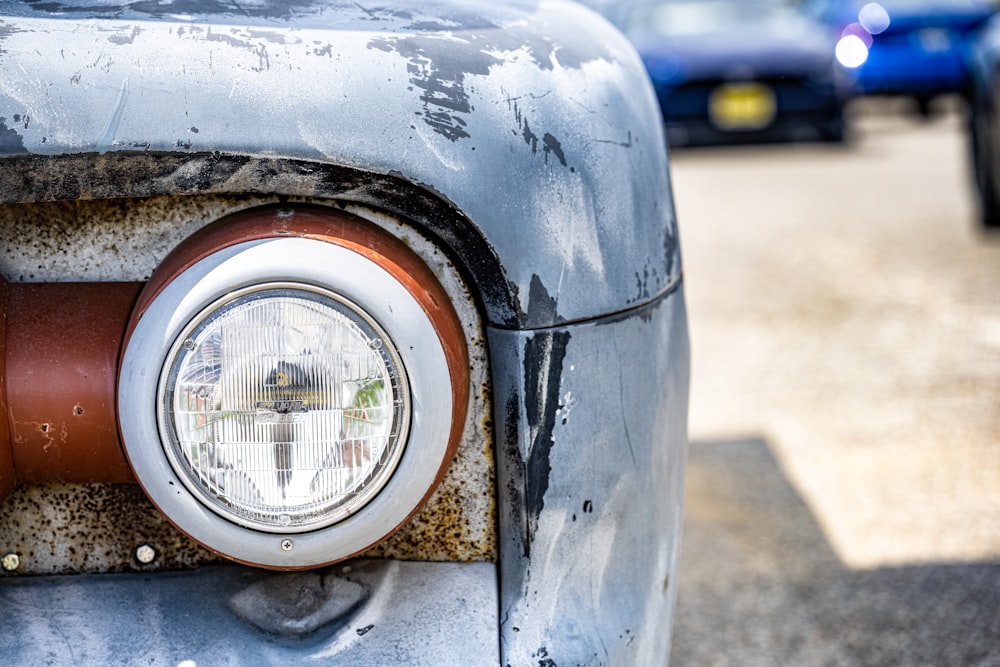 a close up of the front of an old car