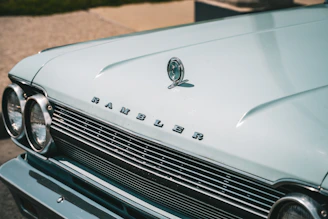 a close up of the front of a classic car