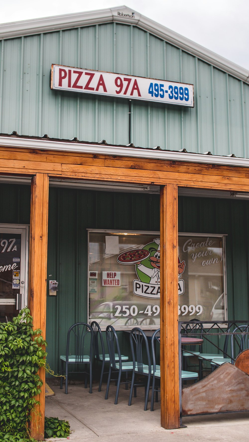 a pizza restaurant with a large sign above the door