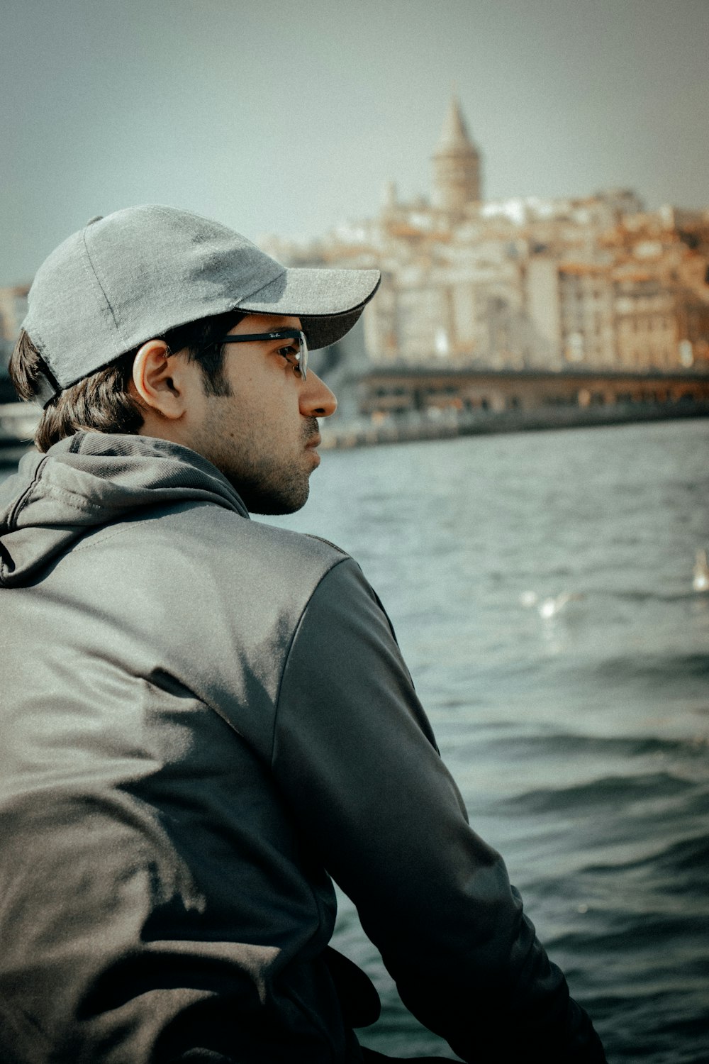 a man sitting on a boat in the water