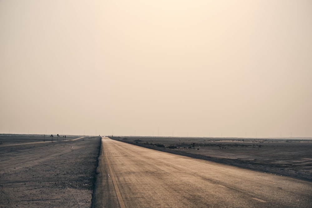 an empty road in the middle of nowhere