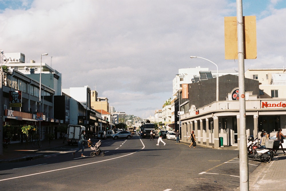 a city street filled with lots of tall buildings