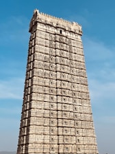 a very tall building with a sky in the background