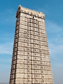 a very tall building with a sky in the background