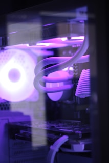a close up of a computer with a purple light