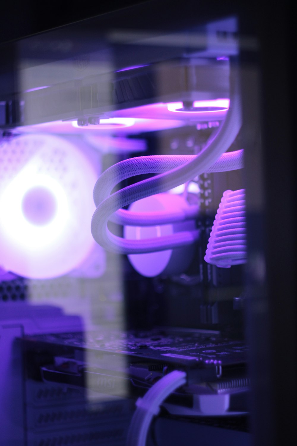 a close up of a computer with a purple light