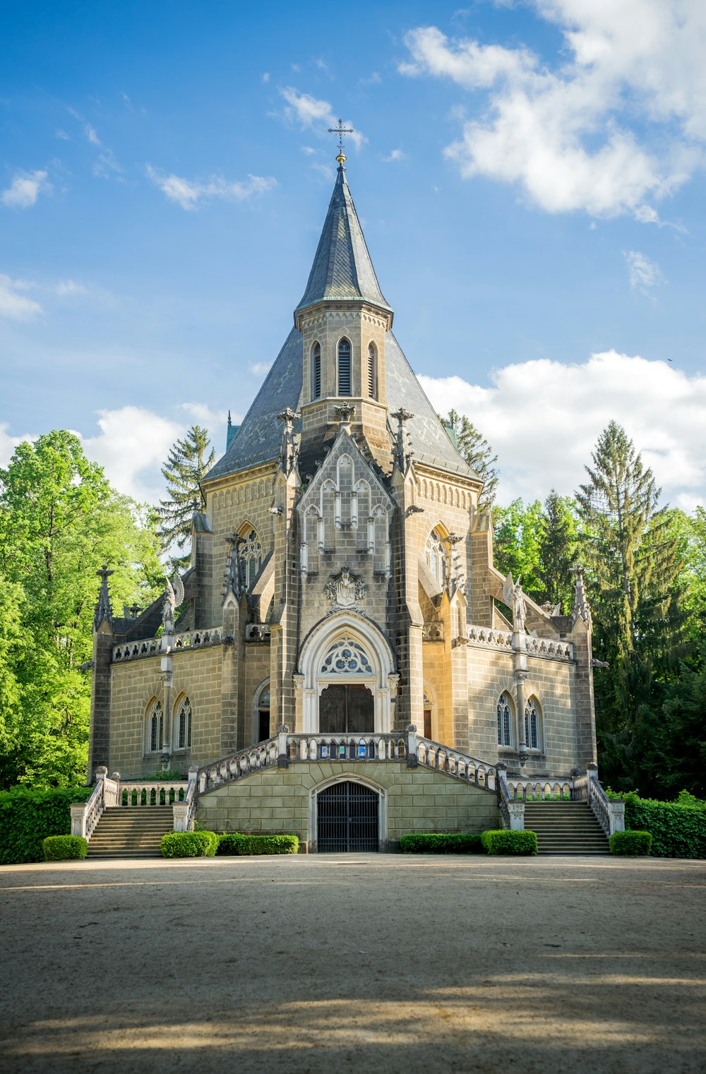 a large building with a steeple and a clock tower