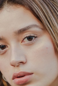 a close up of a person with a cell phone