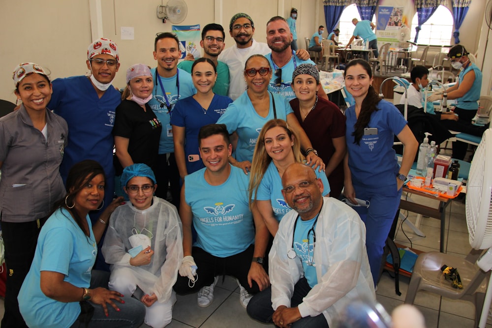 a group of people in scrubs posing for a picture