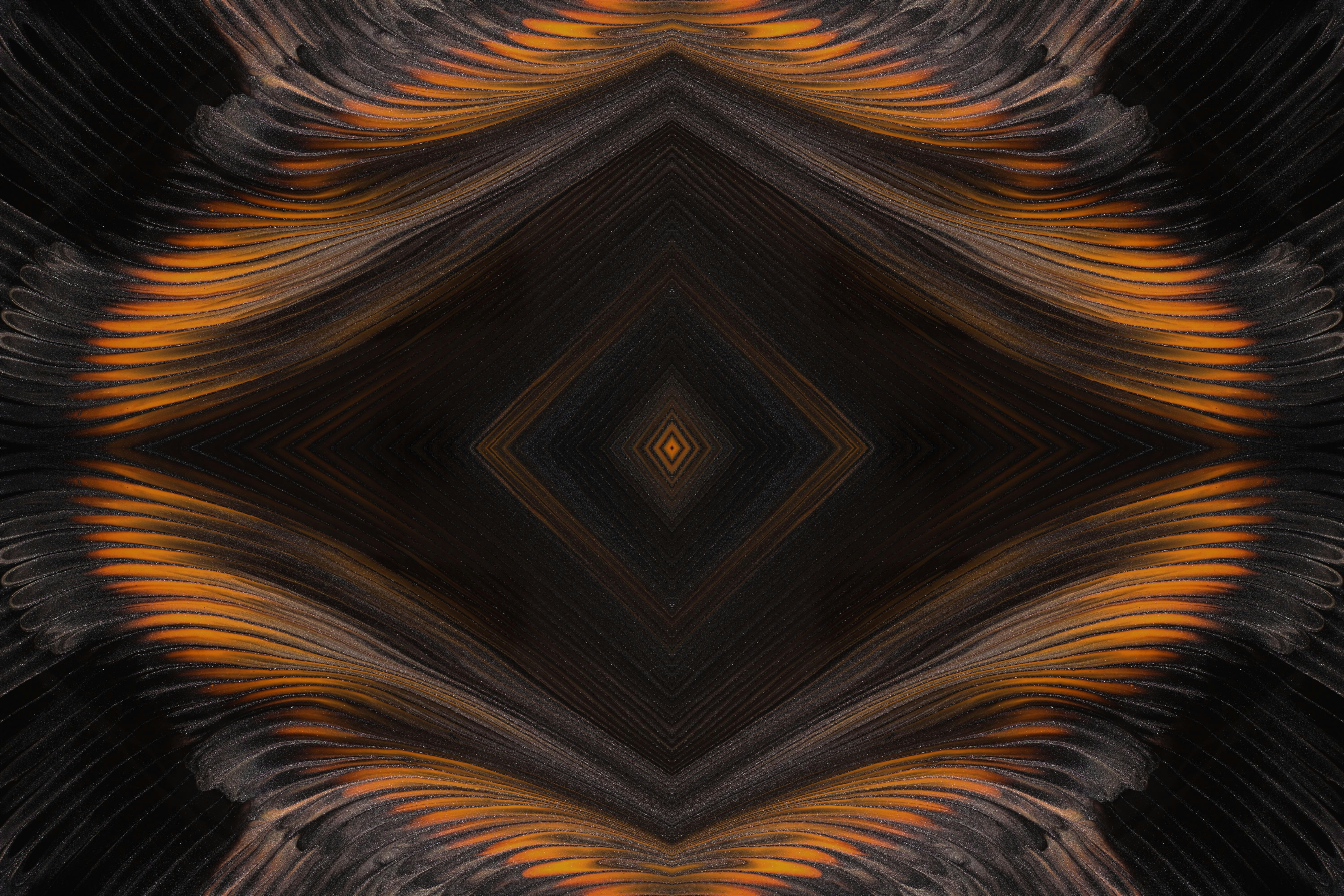 an abstract image of a black and orange pattern