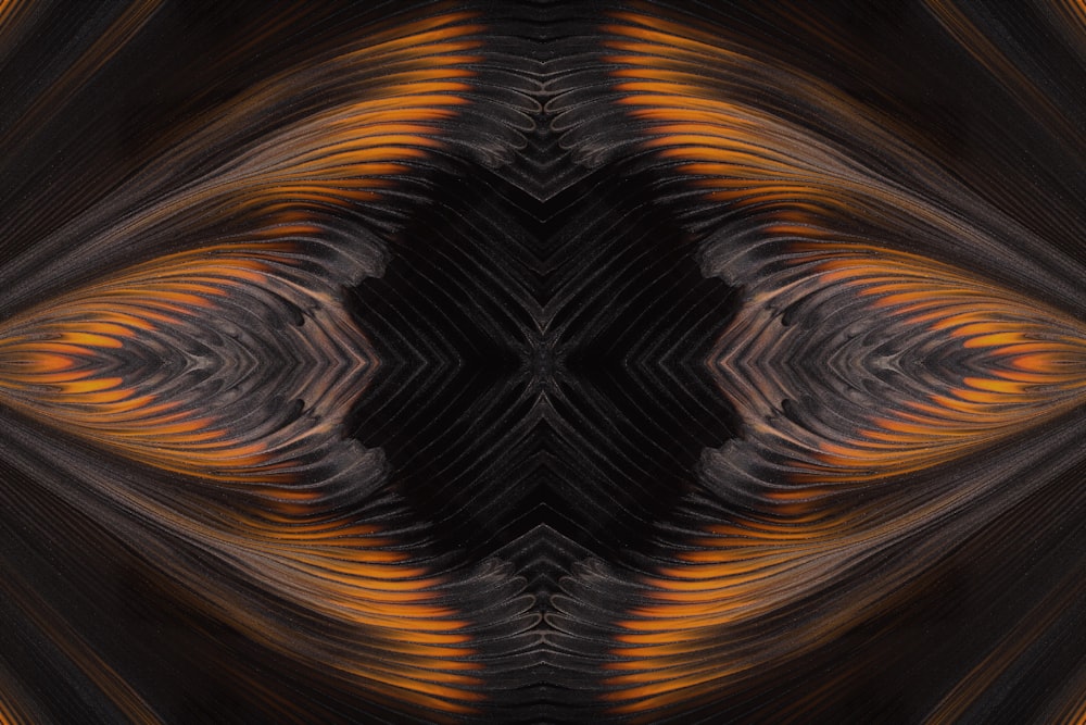 a black and orange abstract background with an intricate design