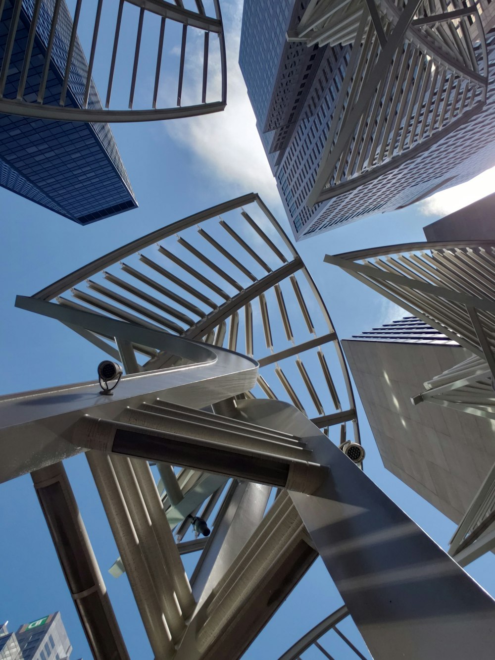 a group of metal structures with a sky background