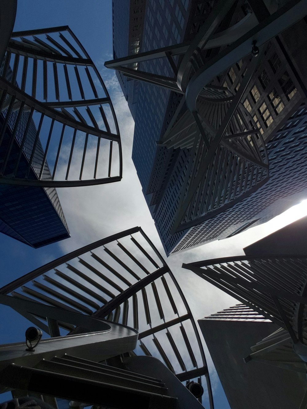 looking up at a group of tall buildings