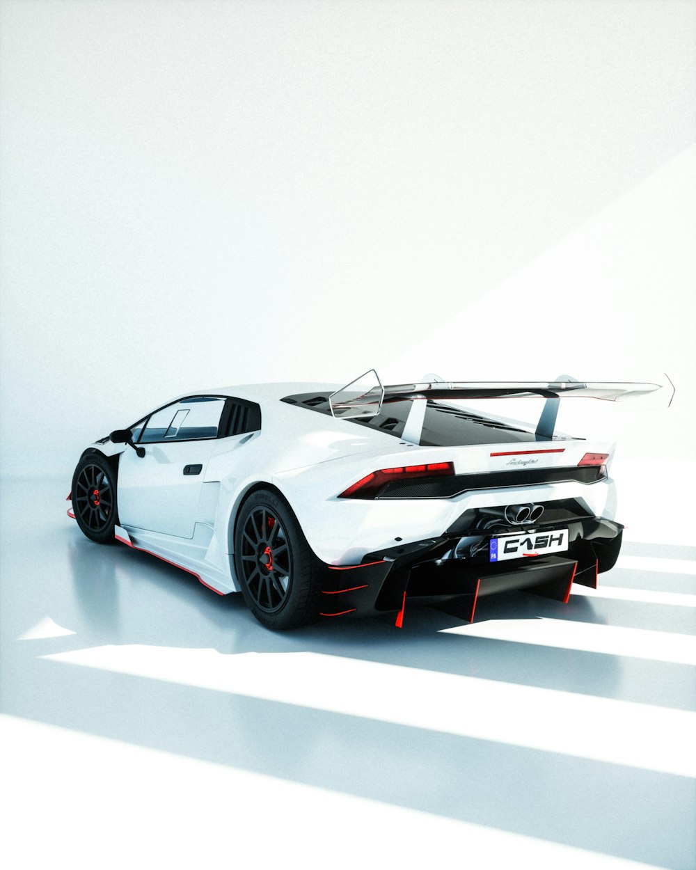 a white sports car parked in a white room