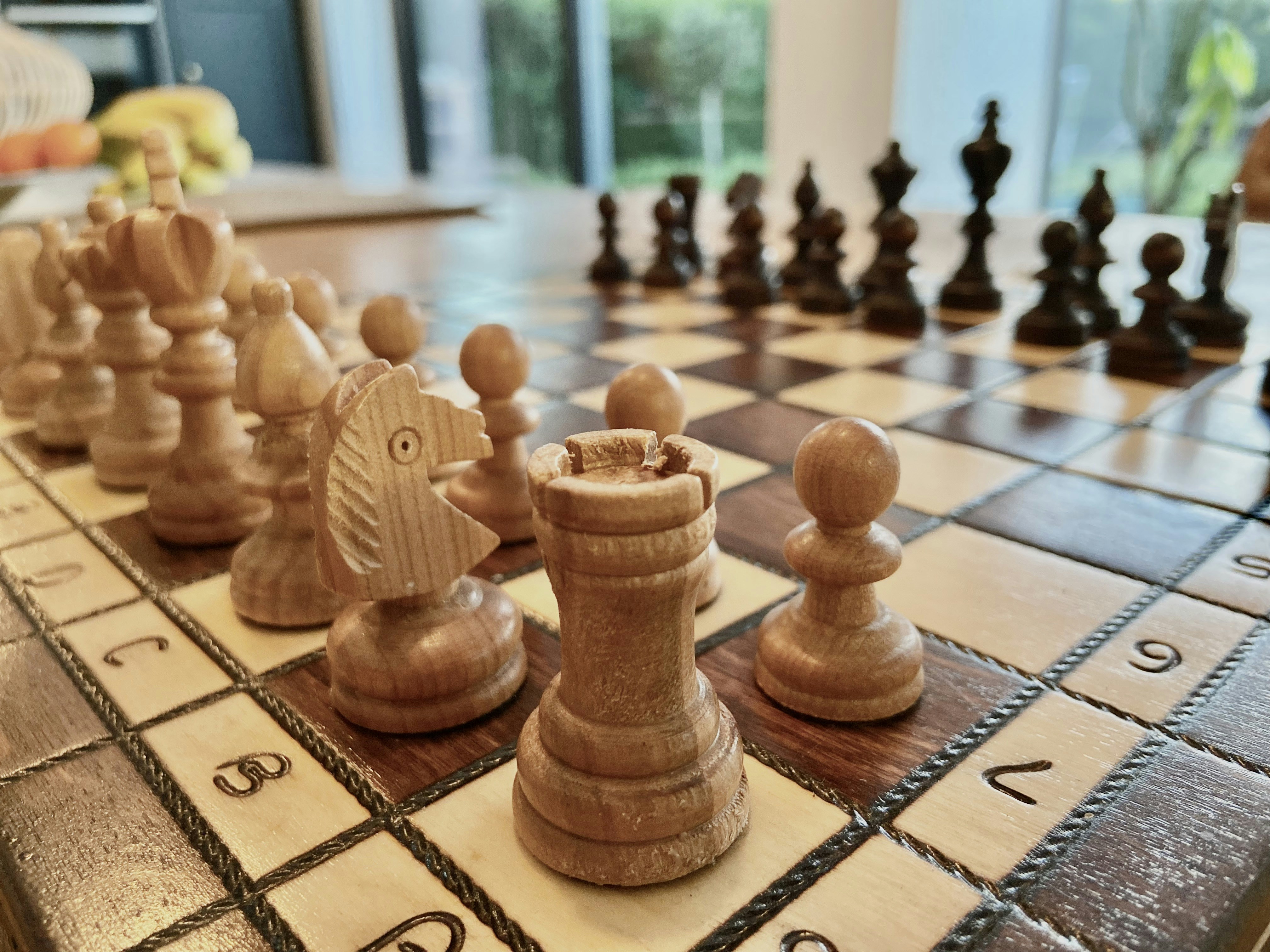 a close up of a chess board with pieces on it