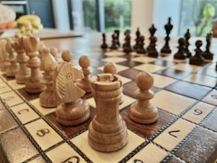 a close up of a chess board with pieces on it