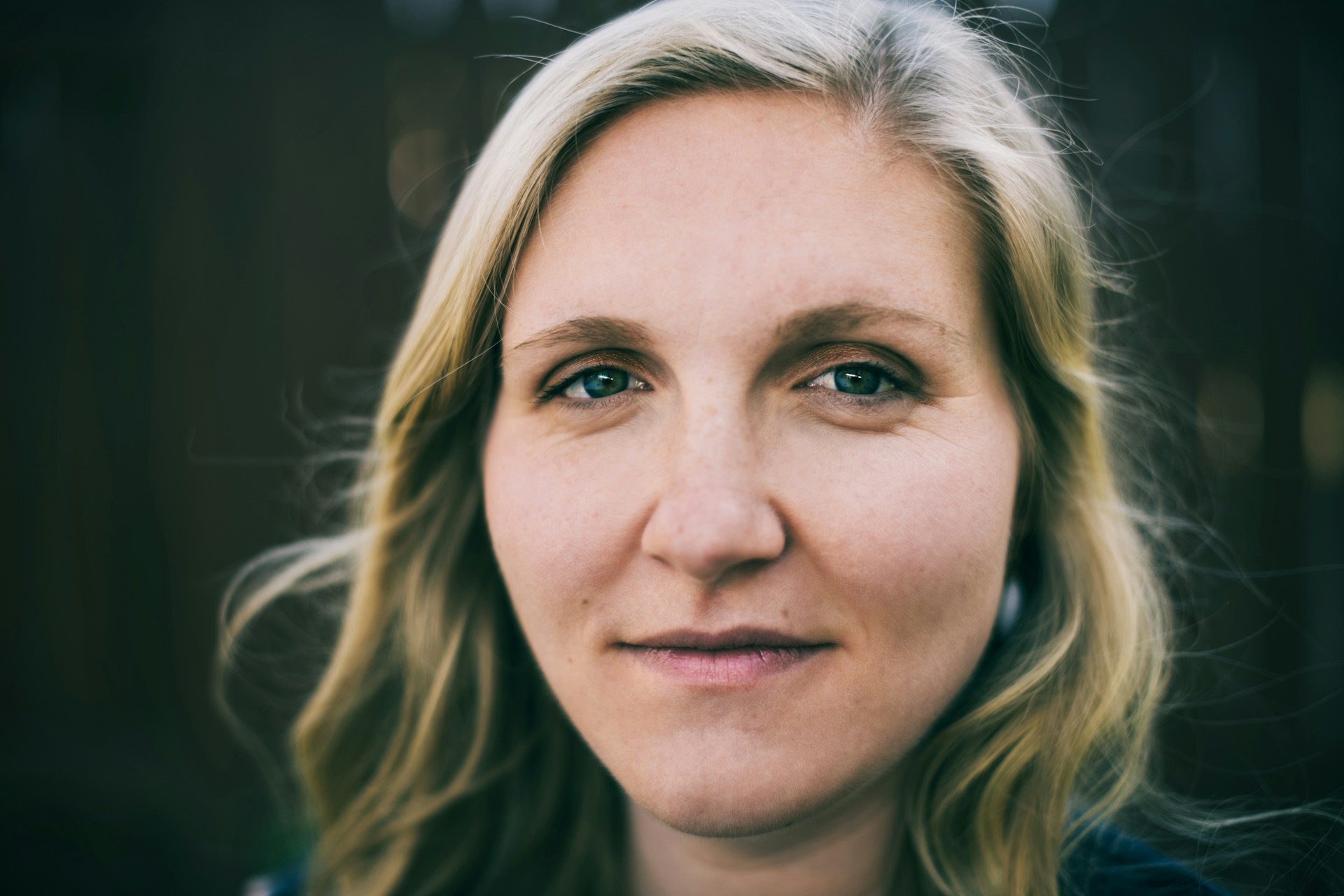 a close up of a person with blonde hair