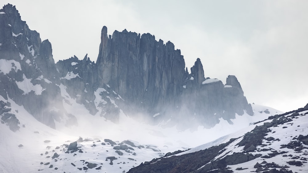 a large mountain with snow on the top of it