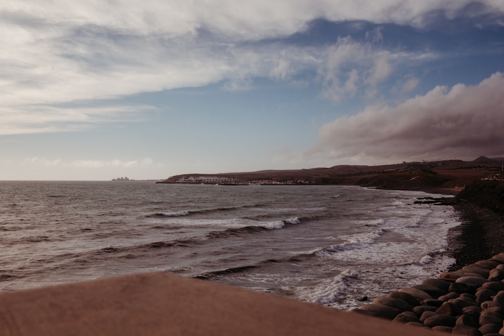 a body of water with waves coming in to shore