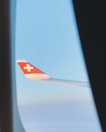 a view of the wing of an airplane from inside the plane