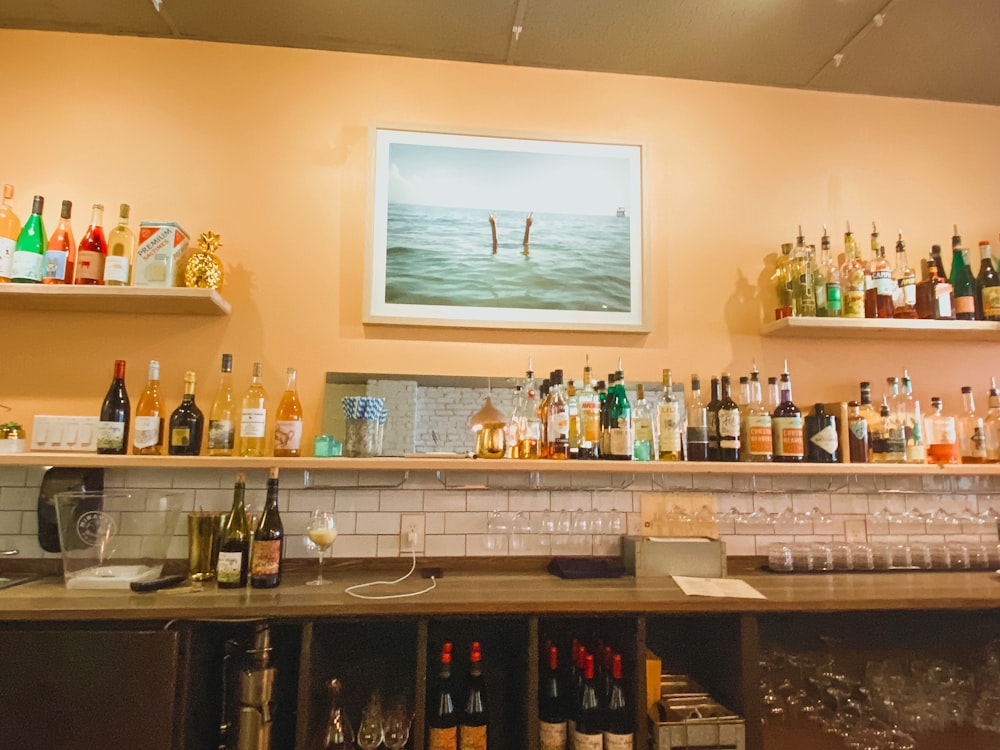 a bar filled with lots of bottles of alcohol