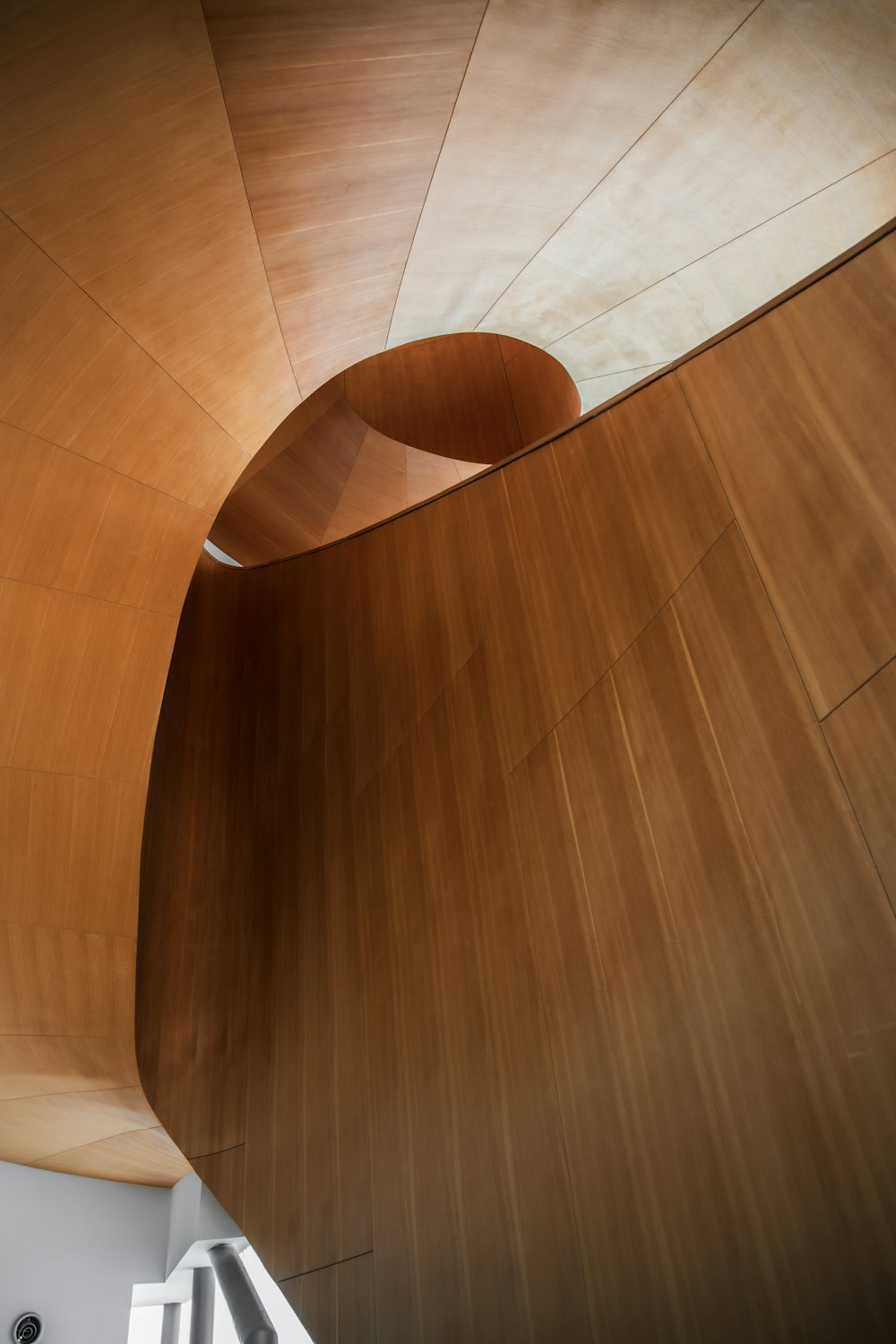 a large wooden structure with a skylight above it