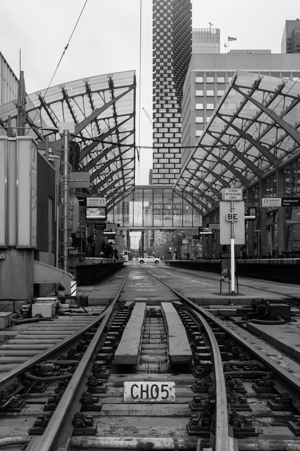 a black and white photo of a train track