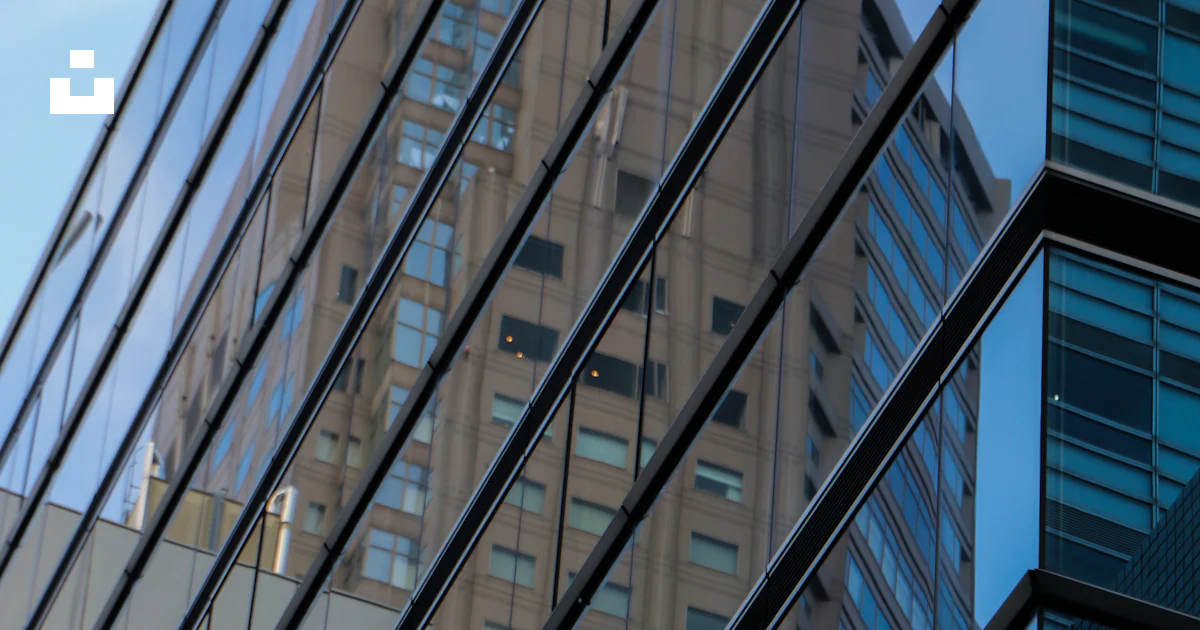 The reflection of a building in the windows of another building photo ...