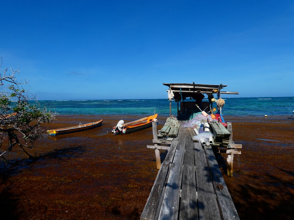 a wooden dock sitting next to a body of water