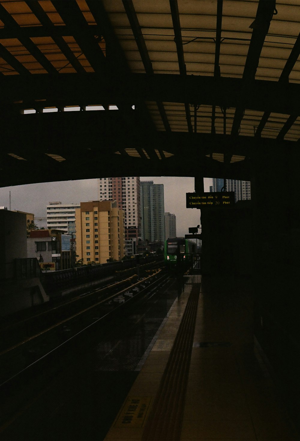 a train station with a train on the tracks