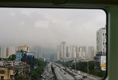 Large window view in Deluxe Room looking out toward the nearby highway.