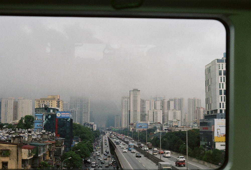 a view of a city from a train window