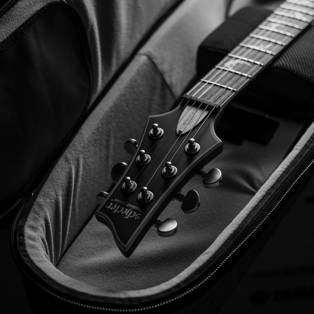 a black and white photo of a guitar case