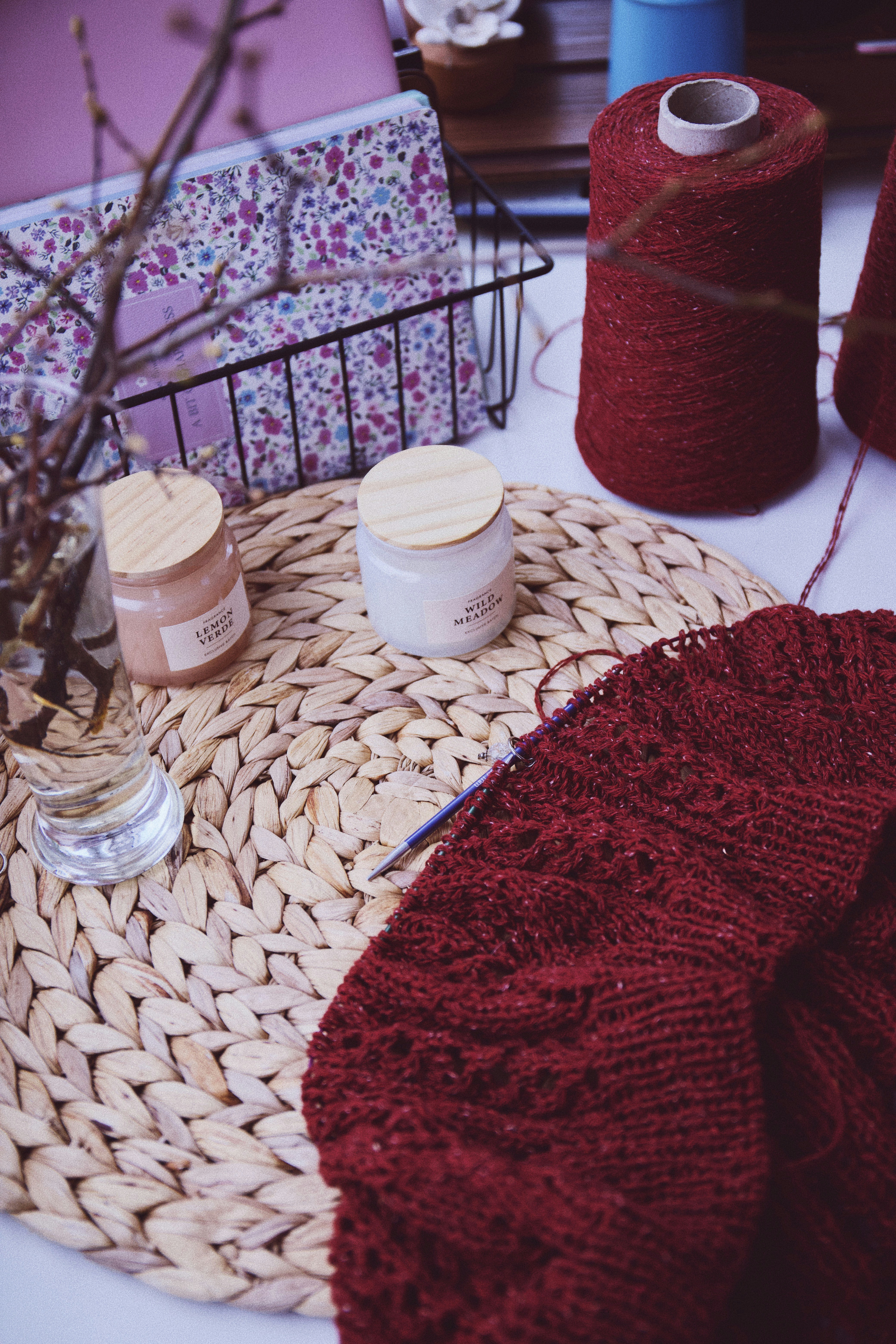 a close up of a table with yarn and scissors