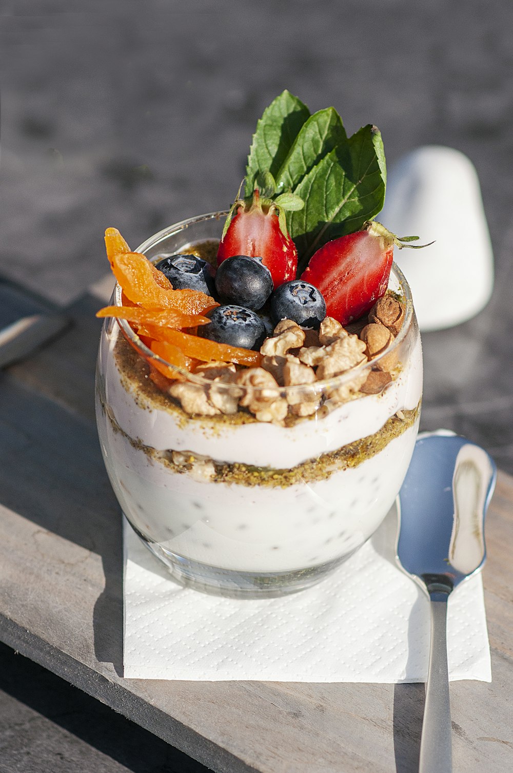 a bowl of food on a table with a spoon