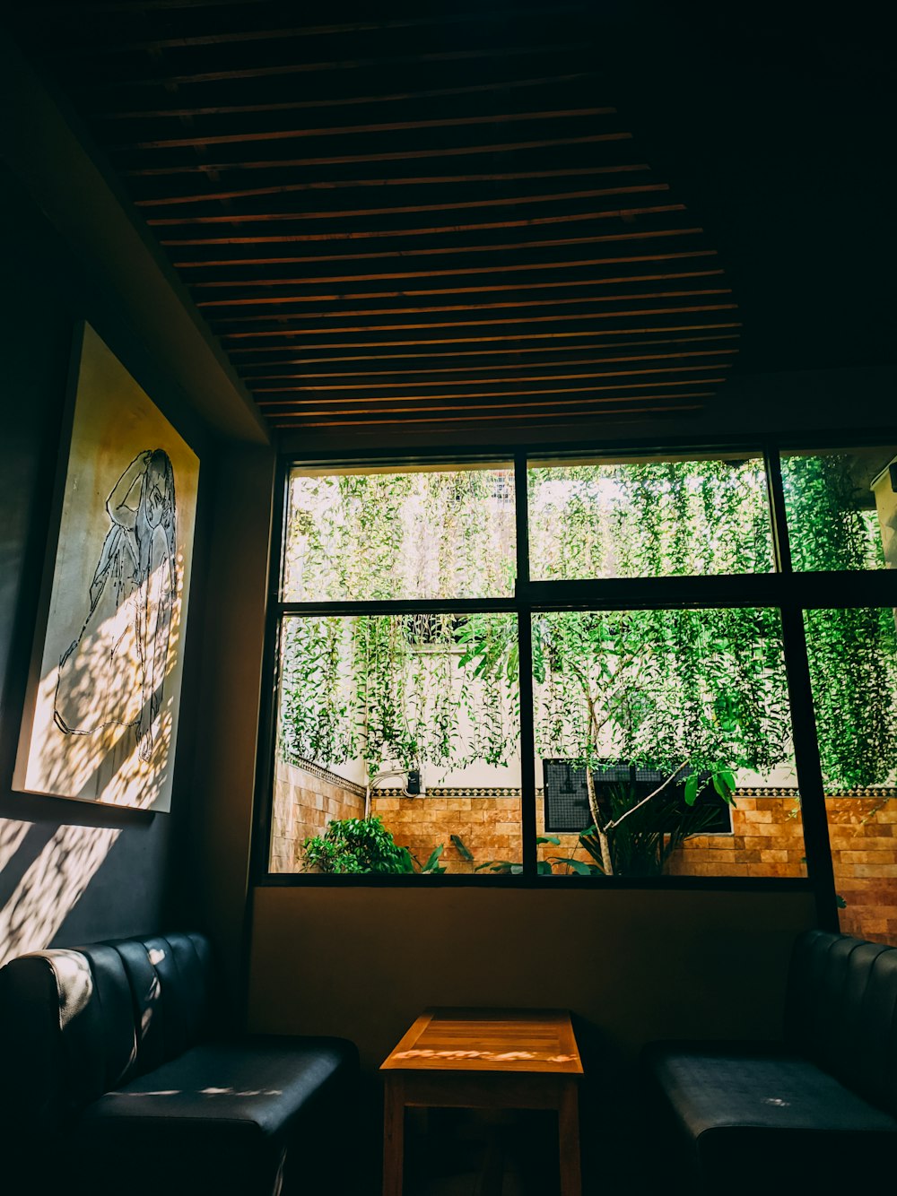 a living room with a couch and a window