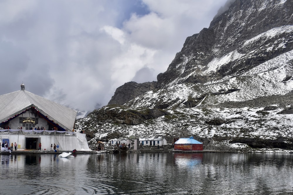 a boat in a body of water with a mountain in the background