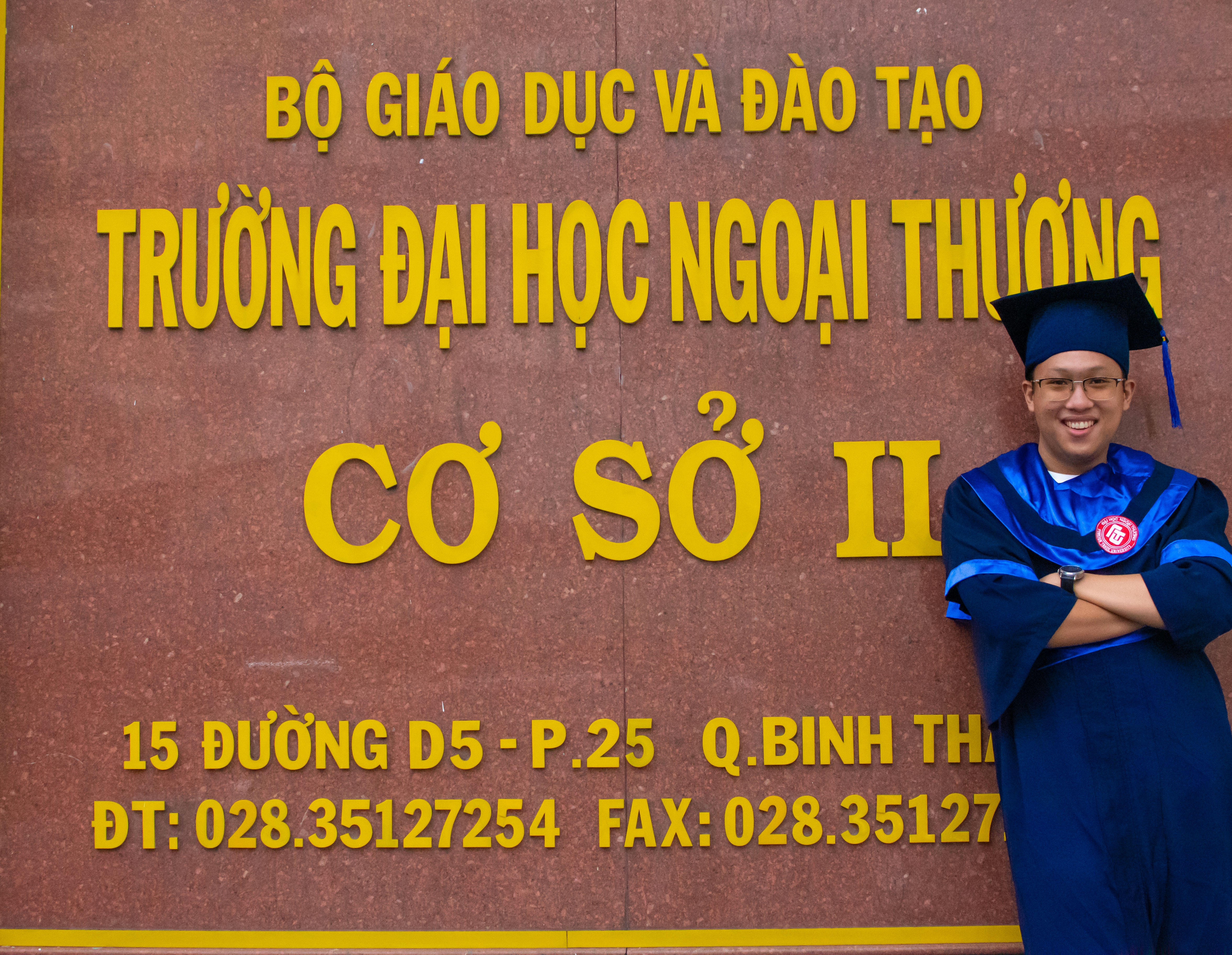 a man standing in front of a sign
