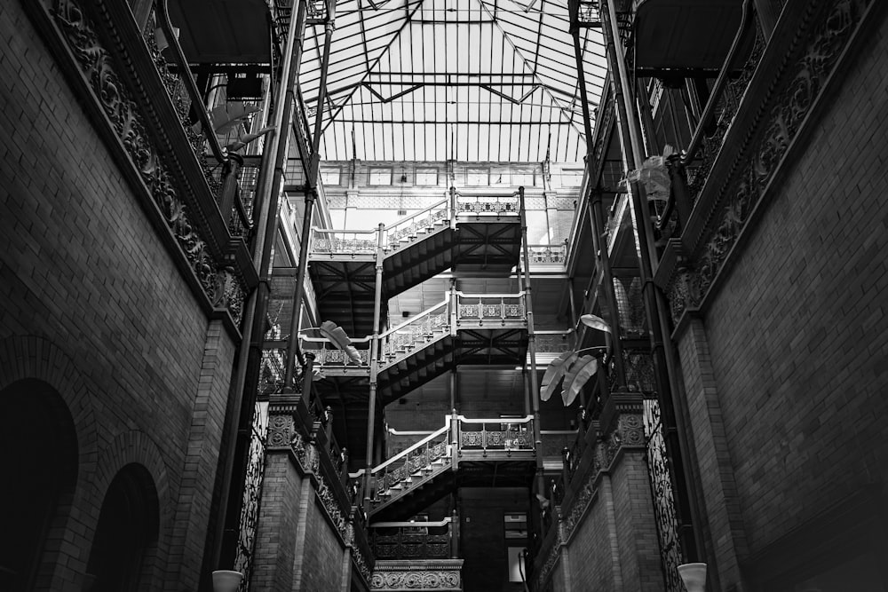 a black and white photo of a staircase in a building