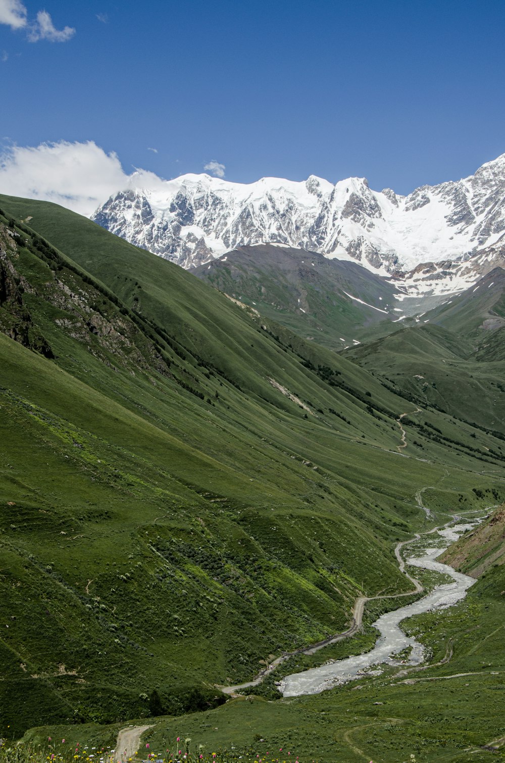 a mountain valley with a river running through it